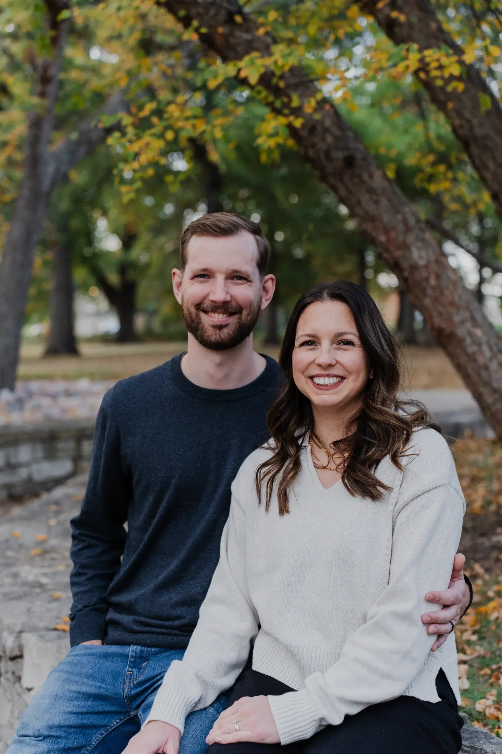 Smiling couple outdoors in autumn park